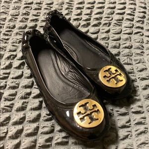 Tory Burch Glossy Black and Gold flats. These fit bigger than 8. More like 8.5.